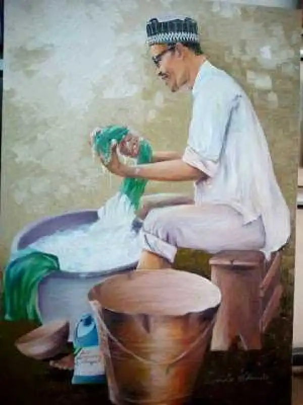 Photo of the day: President Buhari washing clothes